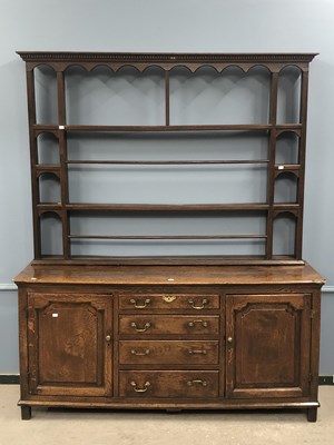 Lot 1300 - A 19th century oak dresser, the open shelf...