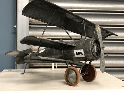 Lot 556 - A metal model three winged single propeller...
