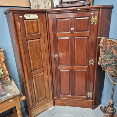 Lot 25 - An antique mahogany panel door corner cabinet...