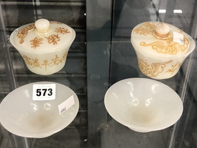 Lot 573 - A pair of Chinese mutton fat jade coloured...