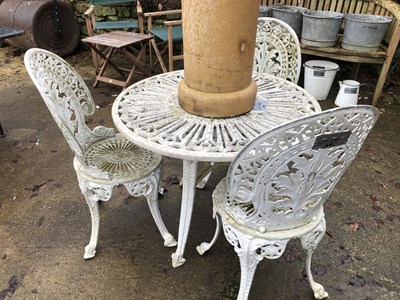 Lot 475 - A white aluminium table with three chairs in...