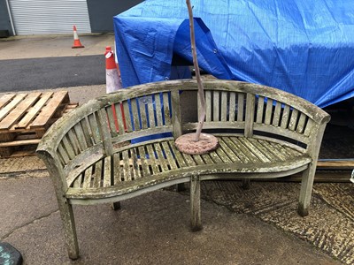 Lot 486 - A bowfronted design garden bench along with a...