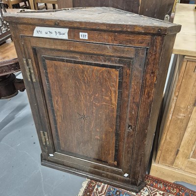 Lot 137 - A Georgian country oak panel door corner...