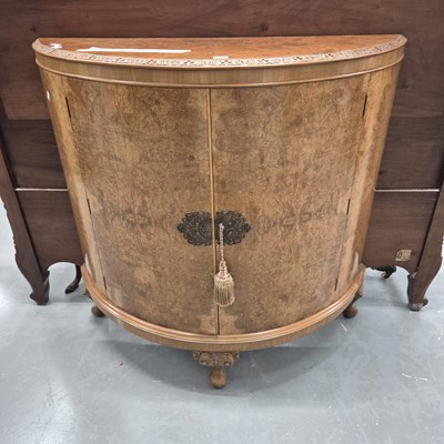 Lot 301 - A walnut demi lune drinks cabinet H 103cm W...