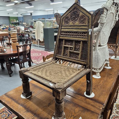 Lot 330 - An eastern gilt hardwood rush seated chair