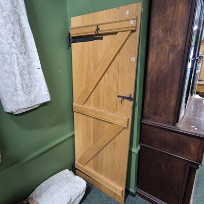 Lot 427 - A solid oak English door.