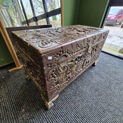 Lot 444 - An oriental carved camphorwood blanket chest H...