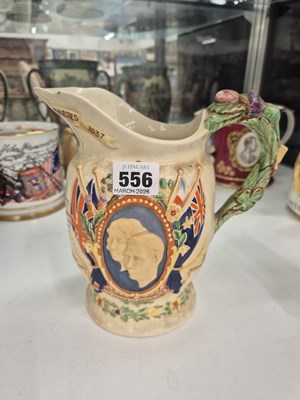 Lot 556 - A Crown Devon pottery musical jug for the...
