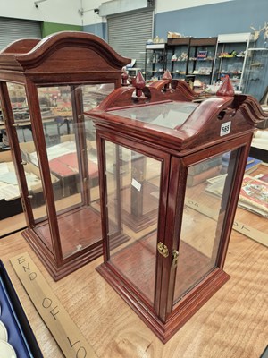 Lot 565 - Three glazed mahogany table top cabinets