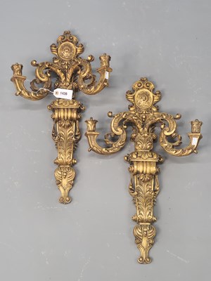 Lot 1436 - A pair of foliate carved gilt wood two branch...