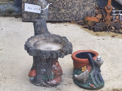 Lot 973 - A painted stone small bird bath, together with...