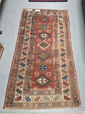Lot 1473 - An antique Caucasian rug 198 × 99cm