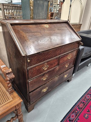 Lot 219 - An early 18th century oak bureau with fall...