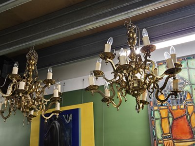 Lot 399 - A pair of large brass multi light chandelier
