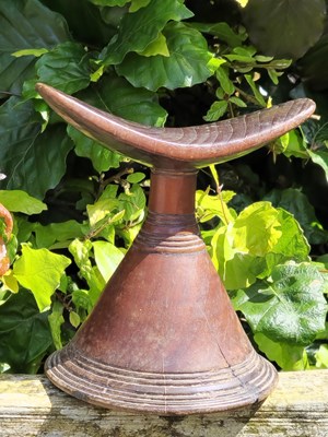 Lot 1720 - An antique African carved wood headrest from...