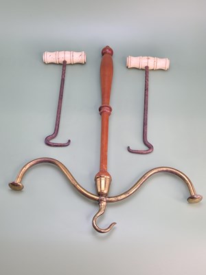 Lot 1727 - A pair of antique bone-handled steel boot...