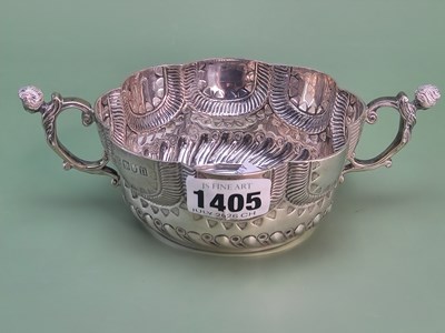 Lot 1405 - A silver porringer, with two caryatid handles...