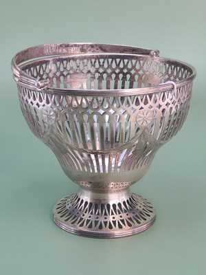 Lot 1408 - A George III silver sugar basket, the pierced...