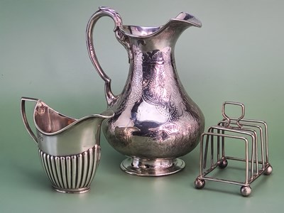 Lot 1421 - A Victorian silver baluster jug, London 1865,...
