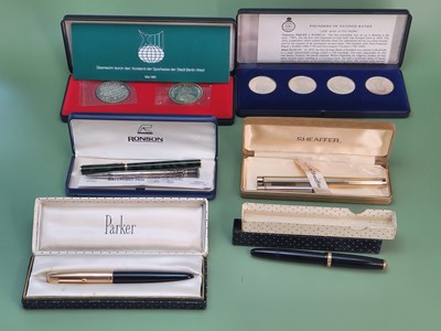 Lot 1432 - Three cased fountain pens, a silver propelling...
