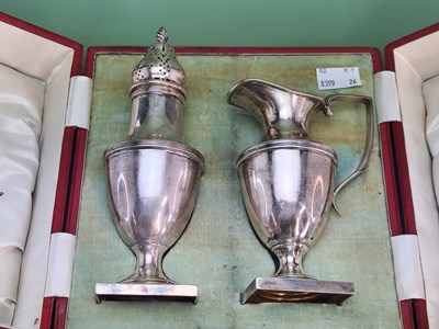 Lot 1435 - A cased silver caster and cream jug, Barker...