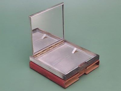 Lot 1457 - A leather cased engine turned silver mounted...