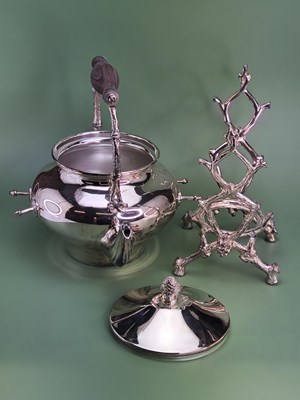 Lot 1801 - A Victorian-style silver-plated tea kettle on...