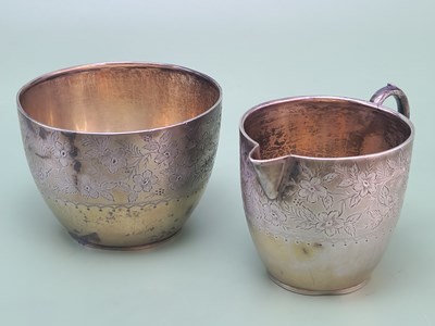 Lot 1478 - A Victorian silver milk jug and bowl, the rims...
