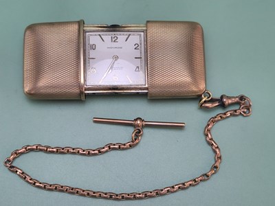 Lot 1482 - A Movado gilt sliding cased travel watch, the...