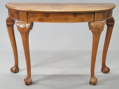 Lot 1491 - An early 20th century mahogany demilune table,...