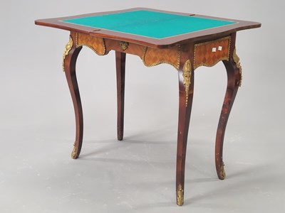 Lot 1497 - A 20th century French swivel top games table,...