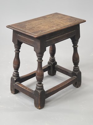 Lot 1499 - An 18th century oak joint stool on baluster...