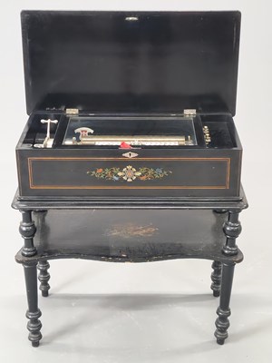 Lot 1504 - An early 20th century ebony table top music...