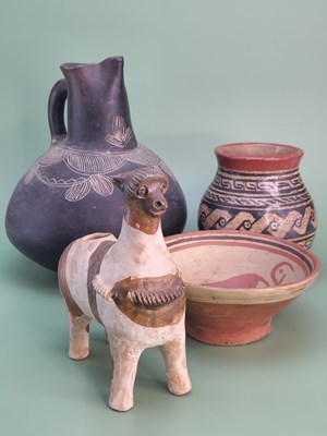 Lot 1509 - A South American terracotta figure of a llama...