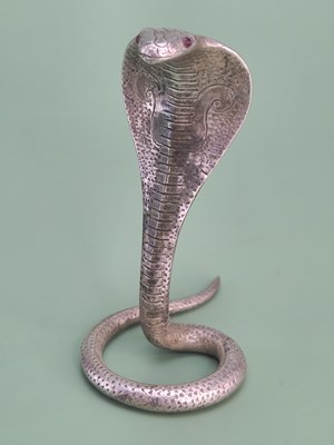 Lot 1821 - A finely cast desk top card holder in the form...