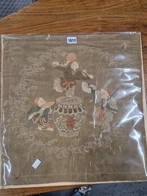 Lot 1513 - An Oriental pale brown silk panel embroidered...