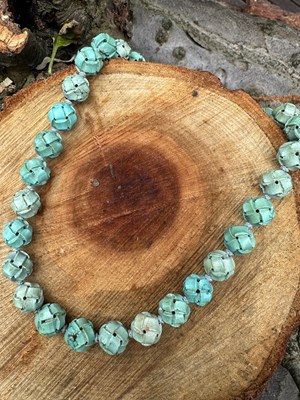 Lot 1028 - A Chinese-style necklace of carved turquoise...