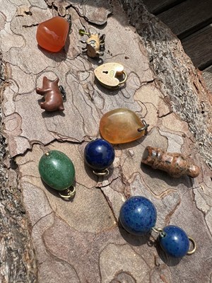 Lot 1021 - A collection of assorted pendant charms and...