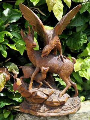 Lot 1742 - A Black Forrest carved pine figure group of a...