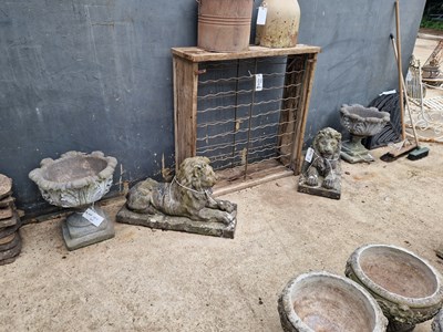 Lot 457 - A pair of concrete planters with floral design...