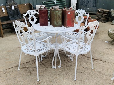 Lot 463 - A cast aluminium table together with four...