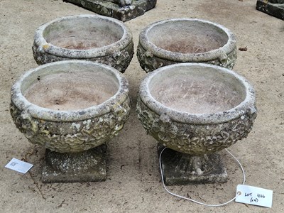 Lot 466 - A set of four cast concrete planters with...