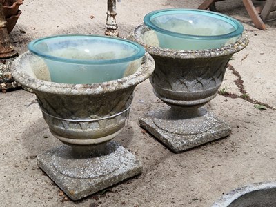 Lot 468 - A pair of concrete planters with glass inserts...