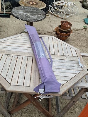 Lot 471 - A garden parasol in bag