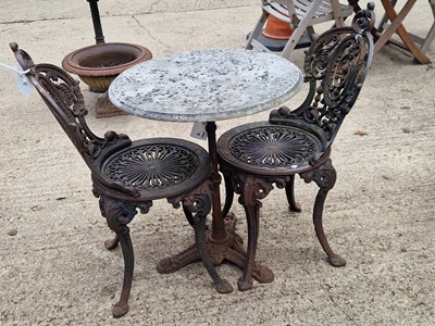 Lot 472 - A pair of iron chairs with a cast-iron-based...