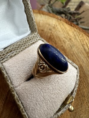 Lot 1193 - An antique dress ring set with an oval...