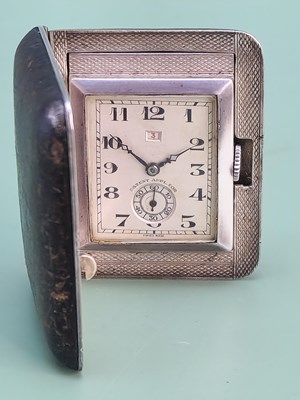 Lot 1787 - An interesting Art Deco silver-cased travel...