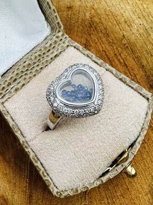 Lot 1067 - A contemporary heart-shaped ring, the central...