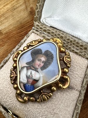 Lot 1161 - An antique brooch centred with an enamel...