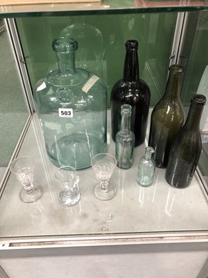 Lot 503 - A glass demi-john, five vintage bottles...